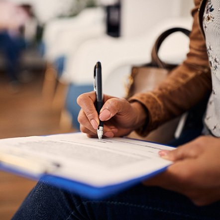 Patient filling out forms in lobby