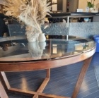 Wooden table with glass top