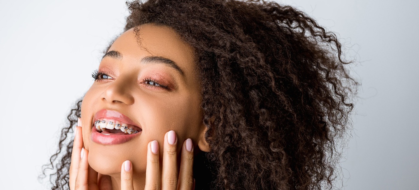 Smiling person with braces